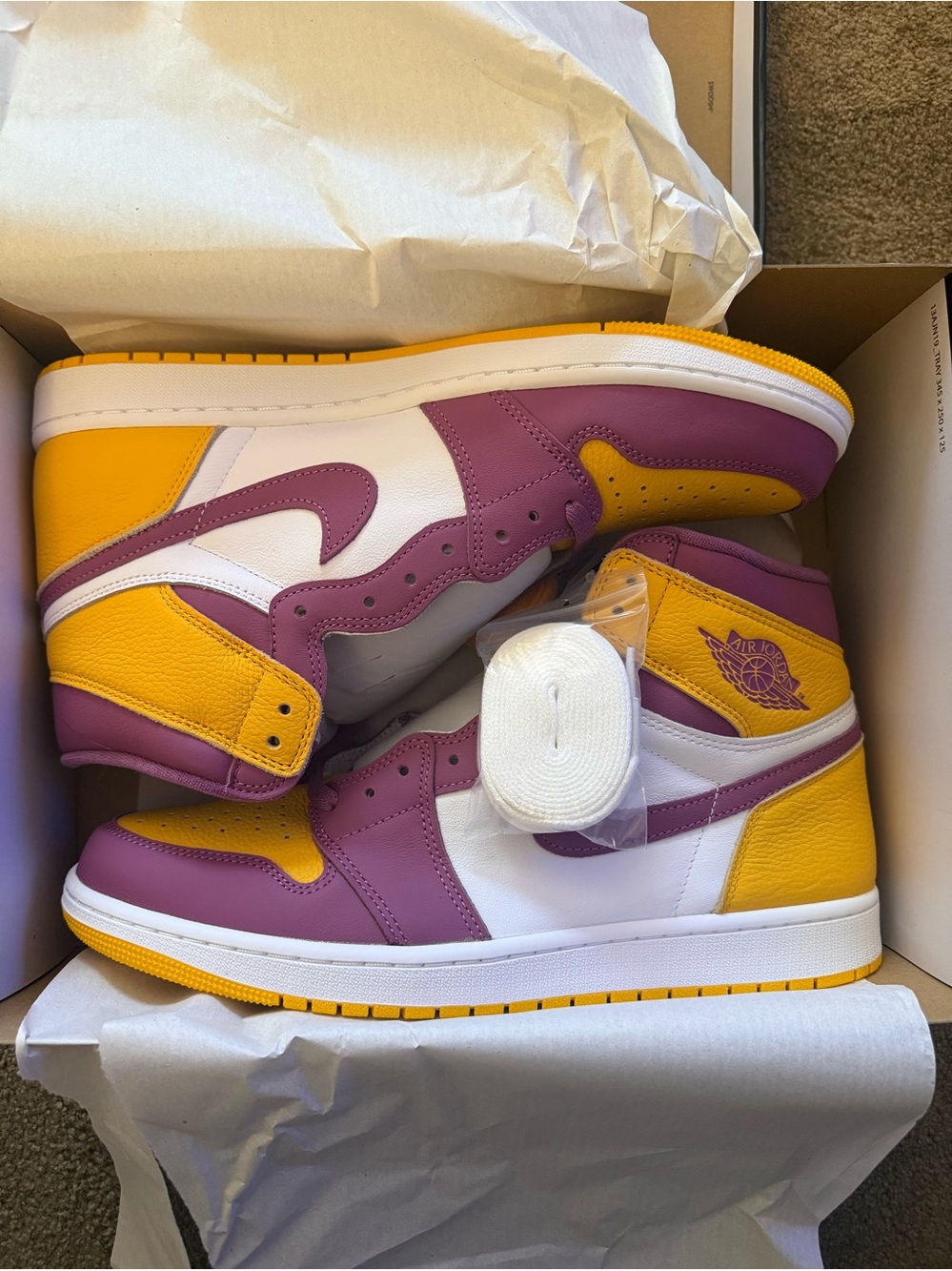 Jordan• 1 Retro High OG in University Gold, Light Bordeaux
